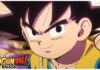 Feature image for our dragon ball daima news showing kid goku with the title logo in the bottom left. Goku has a determined smile on his face in the close-up show of his face